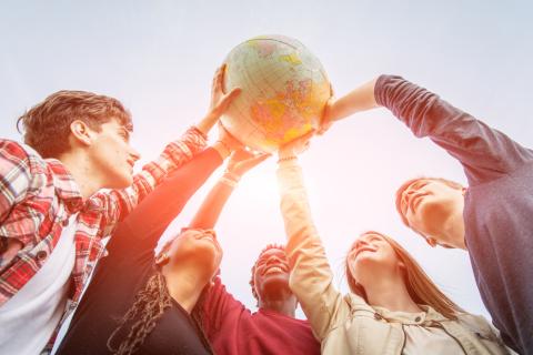 People holding a globe